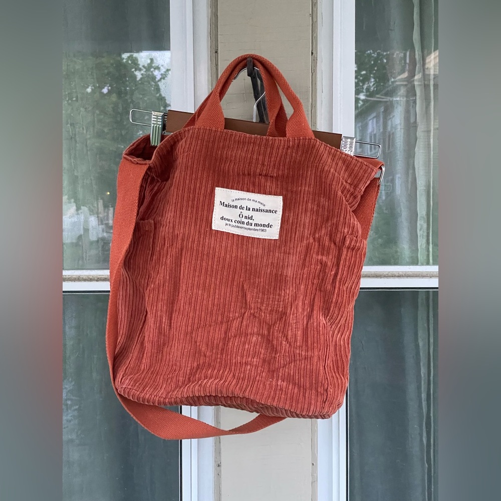 Maison de la naissance, rust tote bag.